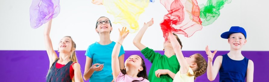 kids-throwing-colourful-scarves-program-participation